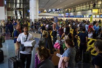 Passengers fill a terminal at Harry Reid International Airport as flights are delayed due to a global technology outage Friday, July 19, 2024, in Las Vegas.


