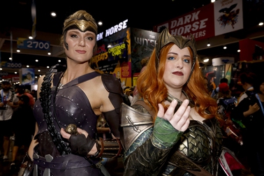 FILE - Susie Cramer of Oklahoma City, Okla., dressed as Antiope from "Wonder Woman," left, and Morgan Duhon of New Orleans, dressed as Mera from "Aquaman," attend Comic-Con International in San Diego on July 20, 2023. The comic book and pop culture extravaganza, which draws over 130,000 fans annually, opens for a preview night Wednesday and runs from Thursday through Sunday.

