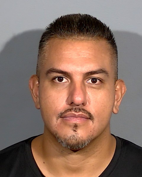 Alejandro Cisneros, 36, is seen in a Metro Police photo. Cisneros has been charged in the death of a woman found by police lying in a roadway on June 28.