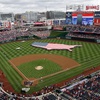 This July 4, 2013, file photo shows a U.S. flag, in the shape of the country, in the outfield before a baseball game between the Washington Nationals and the Milwaukee Brewers at Nationals Park in Washington.