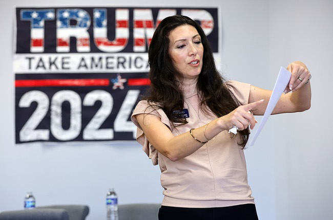 Lorena Biassotti, a candidate for Clark County School Board, District E, displays a Clark County School District form during a Moms For Liberty informational event at the Mesquite Republican Women’s club in Mesquite, Nev. Wednesday, July 31, 2024. The form can be used to request a review of school library resources.