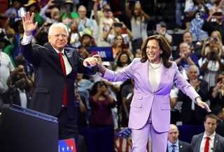 Democratic presidential nominee Vice President Kamala Harris and running mate Minnesota Gov. Tim Walz share the stage during a campaign rally at the Thomas & Mack Center Saturday, Aug. 10, 2024.