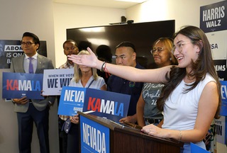 Carolyn Salvador Avila, national president of College Democrats of America, gestures toward her mother, an immigrant from Chile, during a send-off event for Democratic delegates at the Clark County Democratic Party offices Thursday, Aug. 15, 2024. The Democratic National Convention begins Monday in Chicago.