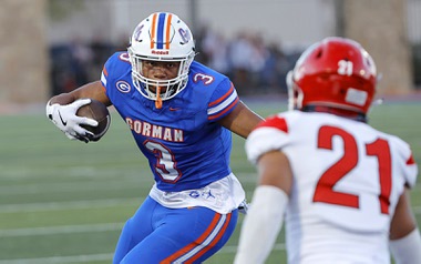 Bishop Gorman running back Terrance Grant (3) carries the ball against Kahuku (Hawaii) High School defensive back Madden Soliai during the first half of a high school football game at Bishop Gorman’s Fertitta Field Friday, Aug. 16, 2024, in Las Vegas.