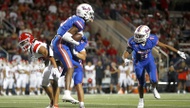 Bishop Gorman quarterback Melvin Spicer rolled out of the pocket midway through the first quarter, looked down field and let loose on a pass attempt.

