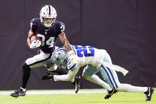 Dallas Cowboys cornerback Andrew Booth Jr. (25) tackles Las Vegas Raiders wide receiver Terrell Bynum (34) during the second half of an NFL preseason football game, Saturday, Aug. 17, 2024, in Las Vegas. (AP Photo/Steve Marcus)