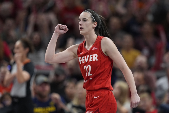 Indiana Fever guard Caitlin Clark reacts during the first half of a WNBA basketball game against the Phoenix Mercury, Friday, Aug. 16, 2024, in Indianapolis. 