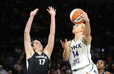 Las Vegas Aces center Megan Gustafson (17) defends against Minnesota Lynx forward Dorka Juhasz (14) during the first half of an WNBA basketball game at Michelob Ultra Arena in Mandalay Bay Wednesday, Aug. 21, 2024.