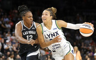 Las Vegas Aces guard Chelsea Gray (12) defends against Minnesota Lynx forward Napheesa Collier (24) during the first half of an WNBA basketball game at Michelob Ultra Arena in Mandalay Bay Wednesday, Aug. 21, 2024.