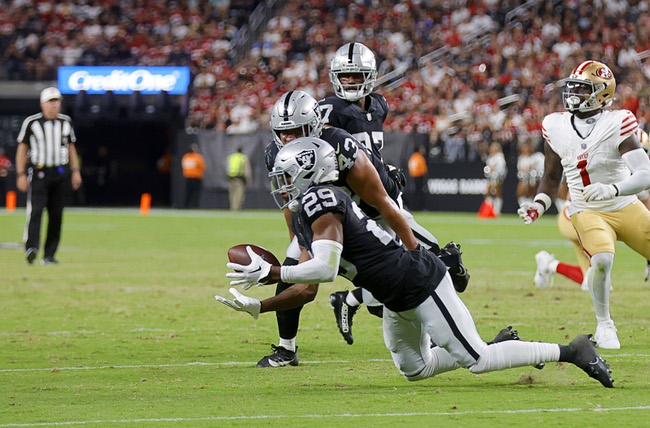 Las Vegas Raiders safety Chris Smith II (29) makes an interception against the San Francisco 49ers during the first half of an NFL football game at Allegiant Stadium Friday, Aug. 23, 2024.