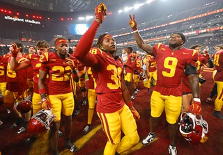 Southern California cornerback Isaiah Rubin (38) and wide receiver Jay Fair (9) celebrate after Southern California defeated LSU in an NCAA college football game Sunday, Sept. 1, 2024, in Las Vegas.