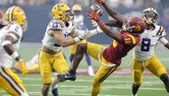 In front of a record crowd of 63,969 fans, USC senior running back Woody Marks exploded through a hole for a 13-yard touchdown run with eight seconds remaining to break a tie. ...     

