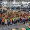 Workers pose at the new Aristocrat Gaming facility.
