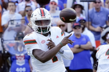 Miami quarterback Cam Ward throws a pass during the first half of an NCAA college football game against Florida, Saturday, Aug. 31, 2024, in Gainesville, Fla.