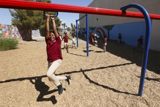 A third grade student swings on a zip line on the playground at Futuro Academy Tuesday, Sept. 3, 2024.