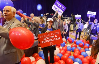 Sari Dennis, center, stands among balloons after a live satellite video speech by Donald Trump during the Republican Jewish Coalition annual leadership summit at the Venetian Thursday, Sept. 5, 2024.