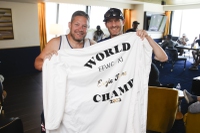 Pat Sorge, 2023 Fantasy Football World Champion, left, and Ian Ritchie, Circa Full Time Fantasy owner, pose for a photo with a robe that Sorge’s wife made for him during the Full Time Full Time Fantasy Football World Championships draft pick party at Circa, downtown, Thursday, Sept. 5, 2024.