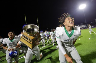 Green Valley players celebrate after Green Valley defeated Basic in the annual Henderson Bowl at Basic High School in Henderson Friday, Sept. 6, 2024. Green Valley quarterback Michael Lewis (15) is at right.