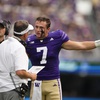 Washington quarterback Will Rogers (7) talks to head coach Jedd Fisch during the first half of an NCAA college football game against Eastern Michigan, Saturday, Sept. 7, 2024, in Seattle.