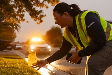 Devyn Choltko steps out of her car to mark the violation with a bright yellow flag. The officer is one of 24 Las Vegas Valley Water District compliance investigators, colloquially known as the water police, who ...