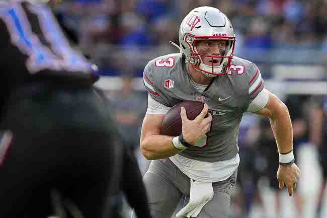 UNLV quarterback Matthew Sluka runs with the ball in the first half against Kansas during an NCAA college football game Friday, Sept. 13, 2024, at Children's Mercy Park in Kansas City, Kan. (AP Photo/Ed Zurga)