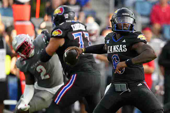 Kansas Jayhawks quarterback Jalon Daniels passes against the UNLV Rebels in the first half of a NCAA college football game , Friday, Sept. 13, 2024, at Children's Mercy Park in Kansas City, Kan. (AP Photo/Ed Zurga)