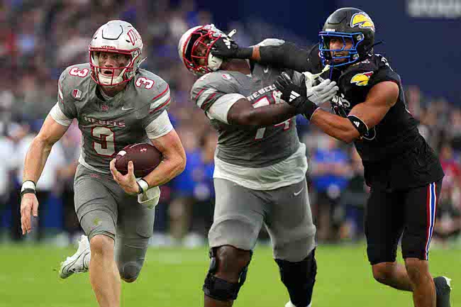 UNLV quarterback Matthew Sluka (3) runs with the ball against Kansas in the first half of an NCAA college football game Friday, Sept. 13, 2024, at Children's Mercy Park in Kansas City, Kan. (AP Photo/Ed Zurga)