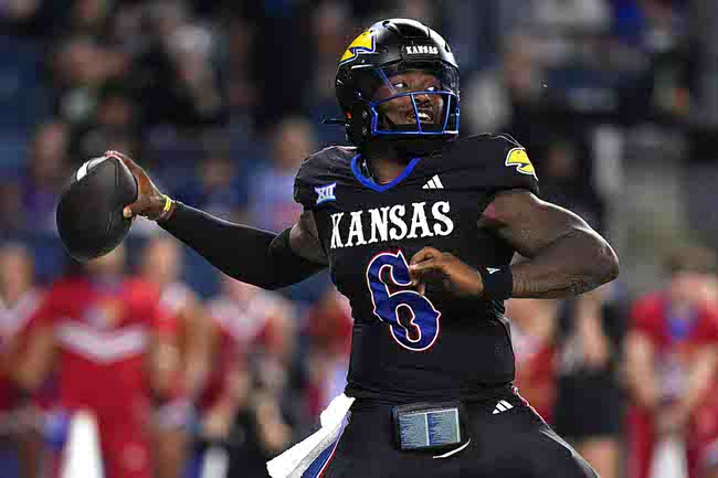 Kansas quarterback Jalon Daniels throws against UNLV in the second half of an NCAA college football game Friday, Sept. 13, 2024, at Children's Mercy Park in Kansas City, Kan. (AP Photo/Ed Zurga)