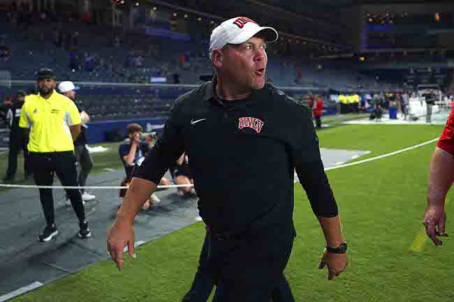 UNLV head coach Barry Odom walks off the field after win over Kansas in an NCAA college football game Friday, Sept. 13, 2024, at Children's Mercy Park in Kansas City, Kan. (AP Photo/Ed Zurga)