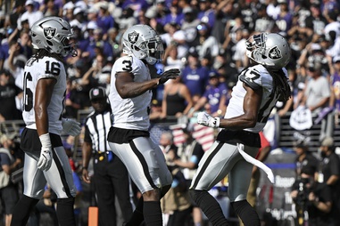 Las Vegas Raiders wide receiver Davante Adams (17), right, celebrates with his teammates after scoring a touchdown during the second half of an NFL football game against the Baltimore Ravens, Sunday, Sep. 15, 2024, in Baltimore.