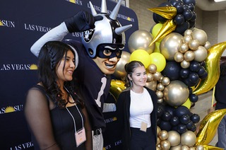 Student pose with Raider Rusher, mascot of the Las Vegas Raiders, during the 66th annual Las Vegas Sun Youth Forum at Cimarron-Memorial High School, Monday, Sept. 16, 2024.