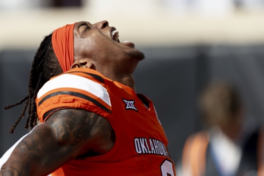 Oklahoma State running back Ollie Gordon II (0) celebrates before an NCAA college football game against Arkansas Saturday, Sept. 7, 2024, in Stillwater, Okla.