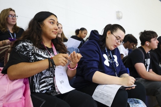 Ruby Velarde, 17, listens to instructions on how to fill out a voter registration form on National Voter Registration Day at Shadow Ridge High School Tuesday, Sept. 17, 2024.