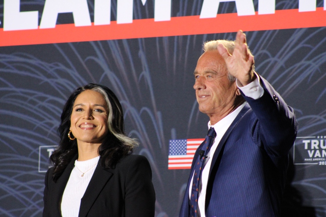 Former House Rep. Tulsi Gabbard, D-Hawaii, and former independent presidential candidate Robert F. Kennedy Jr. wave to crowds at the Reclaim America Tour event at the Bob Price Recreational Center in Las Vegas, Nevada on September 21, 2024. Gabbard and Kennedy, both former Democrats, stumped for former president Donald Trump at the Saturday Q&A, explaining how the former president’s policies aligned closer to their values.