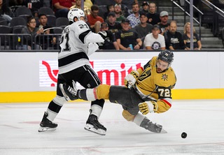 Los Angeles Kings defenseman Jordan Spence (21) defends against Vegas Golden Knights center Gage Quinney (72) during the third period of an NHL preseason game at T-Mobile Arena Wednesday, Sept. 25, 2024.