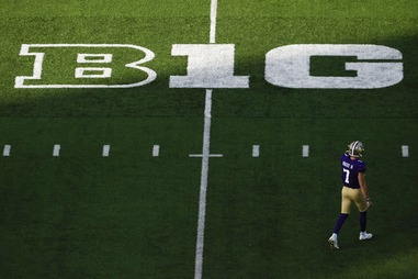 Washington quarterback Will Rogers walks on the field near a Big Ten logo during the first half of an NCAA college football game against Northwestern, Saturday, Sept. 21, 2024, in&nbsp;Seattle. 

