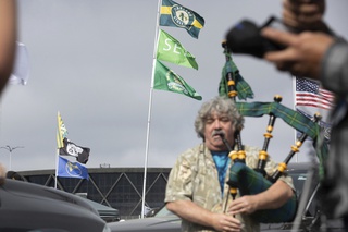 Andrew Johnstone plays the bagpipes outside the Oakland Coliseum before a baseball game between the Oakland Athletics and the Texas Rangers Thursday, Sept. 26, 2024, in Oakland, Calif.