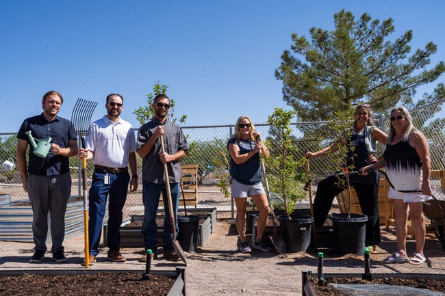 From left, Michael Bauwens, management analyst for Clark County, Mark Moskowitz, South County Liaison to Commissioner Naft, Kyle Myers, President of Searchlight Betterment Organization, Kelly Lehr, the community coordinator for UNR Extension Service Community program, Devon Tilman, community based instructor from UNR Extension Service Community program and Michele Brown, Searchlight Betterment Organization and works for Clark County, pose by the community garden in Searchlight, Nevada on Wednesday, September 26, 2024.