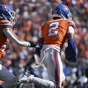 Denver Broncos cornerback Pat Surtain II (2) intercepts a pass and returns it for a 100-yard touchdown during the first half of an NFL football game against the Las Vegas Raiders, Sunday, Oct. 6, 2024, in Denver. 
