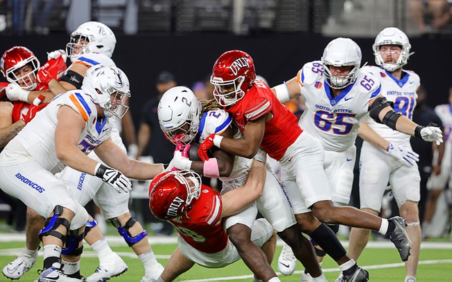 Boise State and UNLV players clash in an action-packed Mountain West Conference showdown.