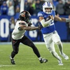 BYU quarterback Jake Retzlaff runs the ball ahead of Oklahoma State cornerback Korie Black in the second half of an NCAA college football game, Friday, Oct. 18, 2024, in Provo, Utah.