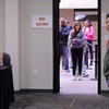 Photo: First time voter Kylee Petersen waits in line to v