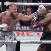 Jake Paul hits Mike Tyson during their heavyweight boxing match, Friday, Nov. 15, 2024, in Arlington, Texas.


