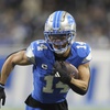 Detroit Lions wide receiver Amon-Ra St. Brown (14) plays against the Green Bay Packers during the second half of an NFL football game in Detroit, Thursday, Dec. 5, 2024.
