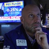 Specialist Meric Greenbaum works on the floor of the New York Stock Exchange as the rate decision of the Federal Reserve is announced, Wednesday, Dec. 18, 2024.