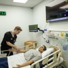 Ryan Latoski, simulation maintenance coordinator for Touro University Nevada, demonstrates interacting with a high-fidelity mannequin simulator Wed. December 18, 2024. Touro University Nevada has become the first fully accredited simulation center in Nevada.