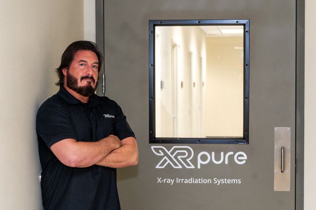 Joseph Bancheri, Sales Manager at XR Pure, an advance irradiation system solution for cannabis producers, capable of eliminating mold, bacteria, mildew and other harmful pathogens, poses with one of the x-ray tubes in Las Vegas, Nevada on Thursday, January 16, 2025.