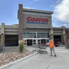 Photo: A cart wrangler gathers shopping carts outside a C