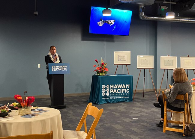 Rudy Pamintuan, chief of staff from the office of Lt. Gov. Stavros Anthony, reads a proclamation during the grand opening of Hawai'i Pacific University's new campus in Las Vegas, Nevada on Tuesday, February 18, 2025.
