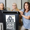 Photo: Defrauded workers pose at the Arriba Las Vegas Wor